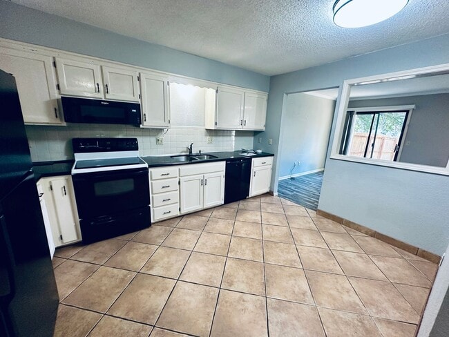 Photo - {1423} Updated Townhome + Two Car Garage + Fenced Yard + Lawncare Included