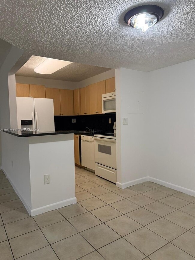 Building Photo - 7160 NW 179th St Unit 104 Rental