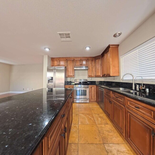 Photo - Stunning 2-Story Home with a Bedroom downstairs and a Backyard Oasis.