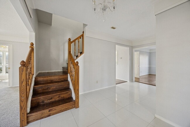 Photo - "Coming Soon! Spacious 4-Bedroom, 2.5-Bath Living Meets Storybook Backyard Charm!"
