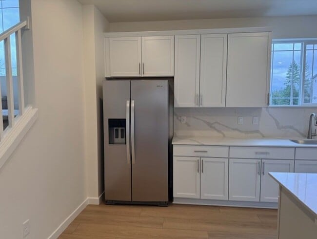 Photo - Elegant 4-Bed, 4-Bath 3-Story Home with Gourmet Kitchen & Private Backyard