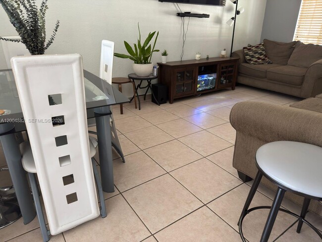 Building Photo - 6962 NW 179th St Unit 201