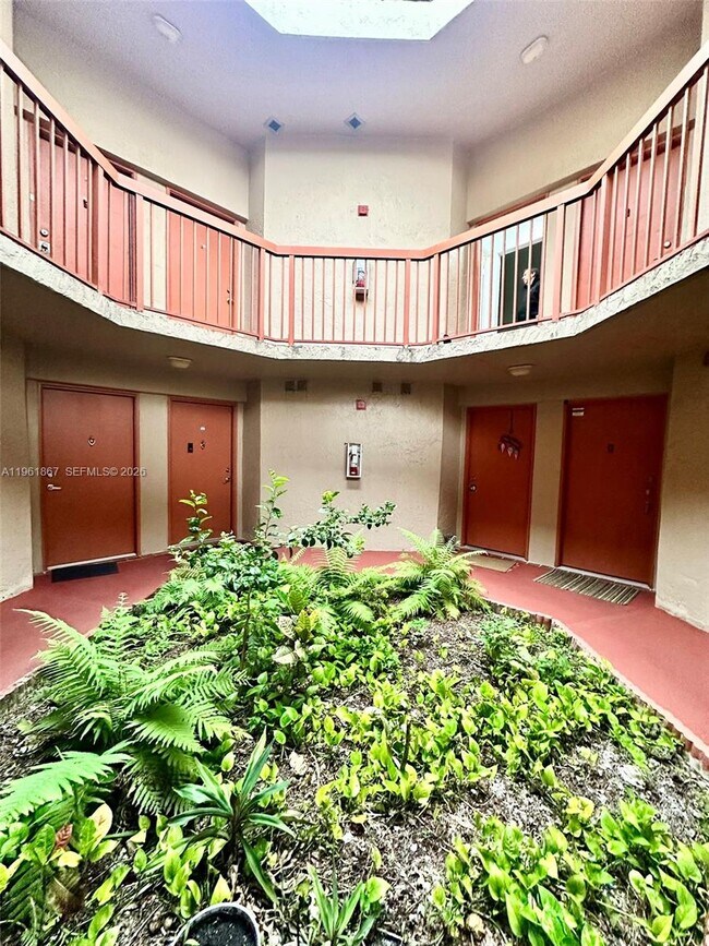 Building Photo - 10237 NW 9th St Cir Unit 210-4