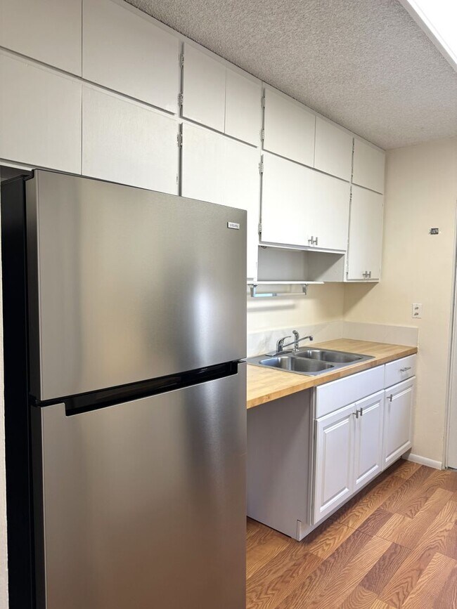 Photo - Koko Isle Circle - 3 bedroom, 2 full bath, 1 half bath with two car carport