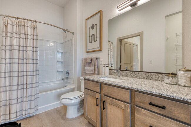 Bright bathroom with modern finishes and ample storage at Residence at Pearsall Park