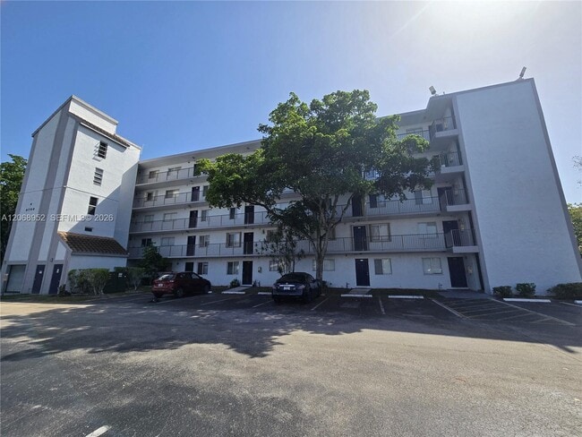 Building Photo - 8700 N Sherman Cir Unit 108