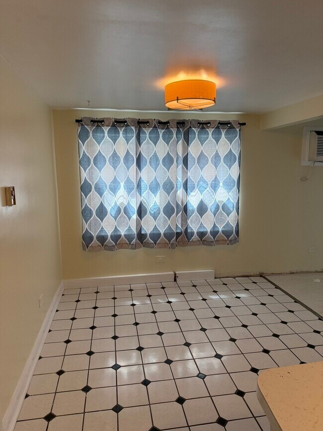 5743 S Kenton Ave Unit 1S