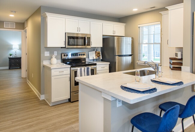 Typical kitche with dishwasher, pantry, & breakfast bat - Lehigh Park Townhouses & Apartments