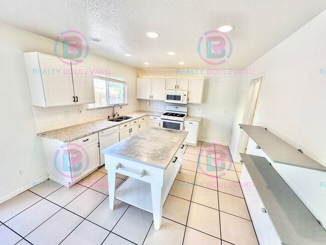 Photo - Gorgeous 4BR Home with Granite Counters, Open-Concept Living & 2 car garage