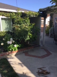 side view, with front door open - 4350 Corinth Ave Unit 1