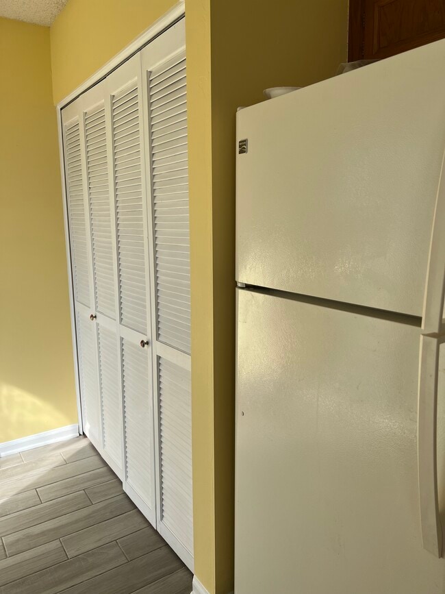 Kitchen inside closet for washer and dryer hookup - 8340 Westover Ct