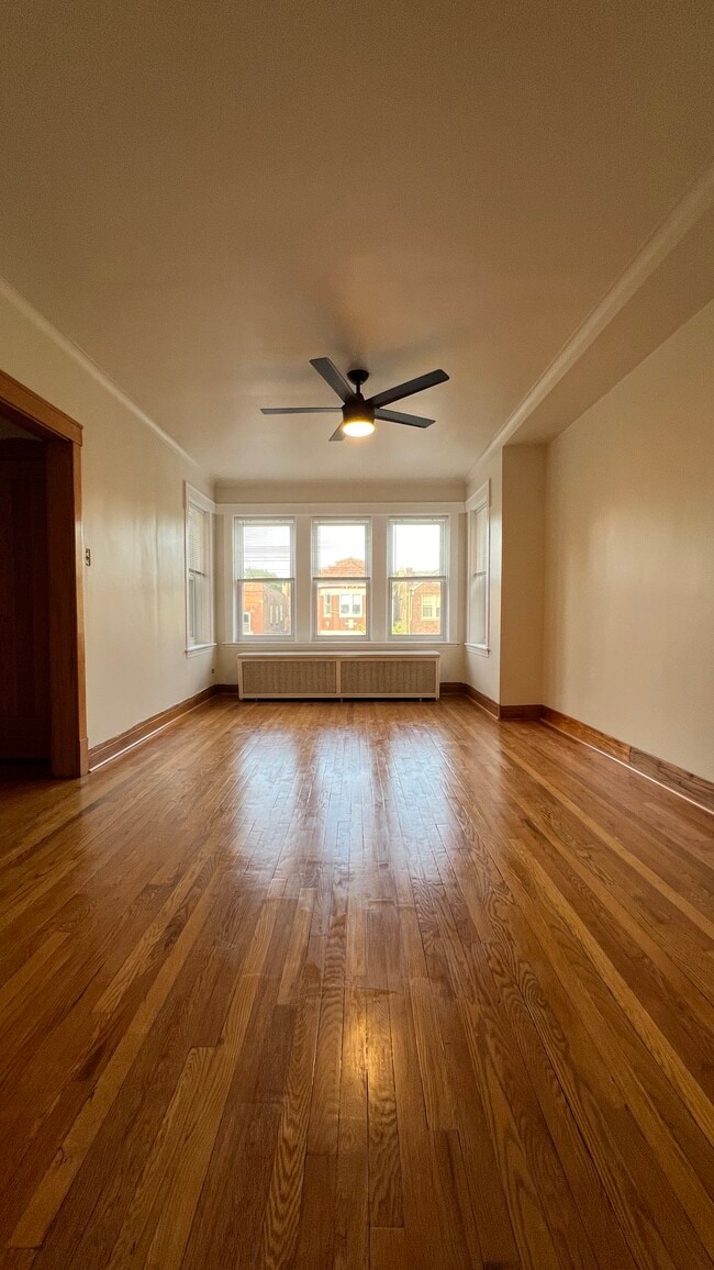 Living room with fan - 3354 N Springfield Ave Unit 2nd Floor