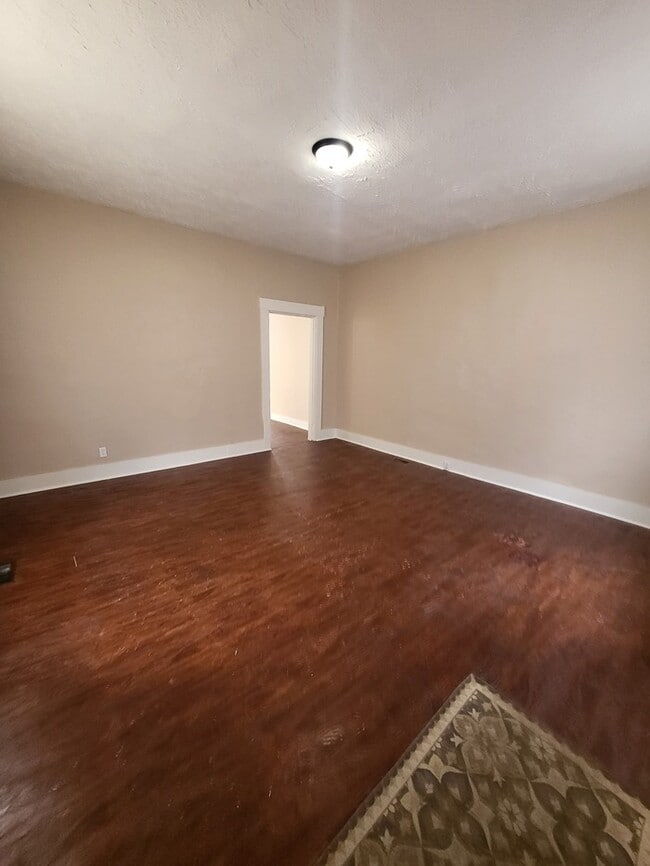 Photo - Cozy, clean, stove, fridge, and washer/dryer