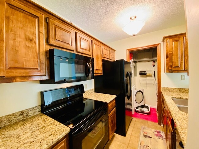 Photo - {12030 - F}  Updated Condo in Fantastic Location + Top Floor + Covered Parking Included + Private...