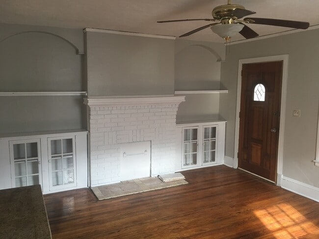 Large living room with hardwoods and built-in book shelves - 728 Pearce Street Southwest