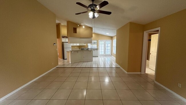 Building Photo - SPACIOUS 4-BEDROOM HOME WITH SCREENED POOL IN SE CAPE CORAL