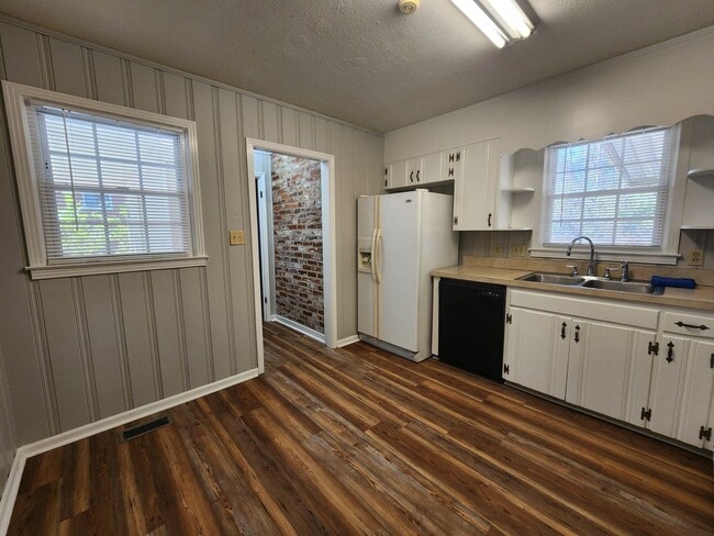 Photo - Spacious 3-Bedroom Brick Home with Two Living Areas & Fenced Backyard!