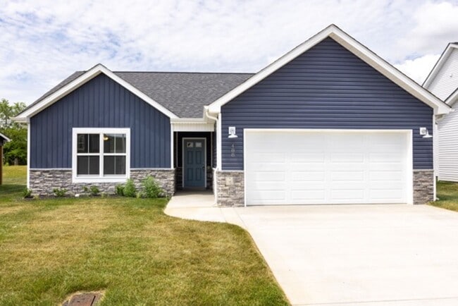 Building Photo - Modern Living Redefined with Stone Fireplace, Gray Cabinetry, Spa Inspired Primary Suite and Cove...