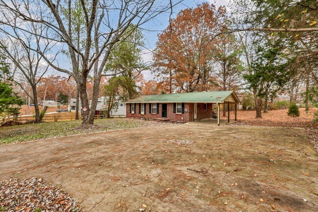 Photo - Cozy 3BR Home with Spacious Yard & XL Carport!