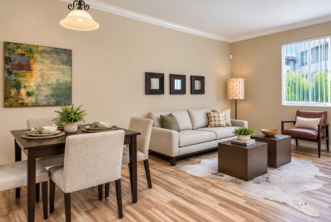 Step into elegance at The Pointe, where modern design meets comfort. This inviting living space features stylish furnishings and warm tones, perfect for relaxation or gatherings. Explore your new home today!