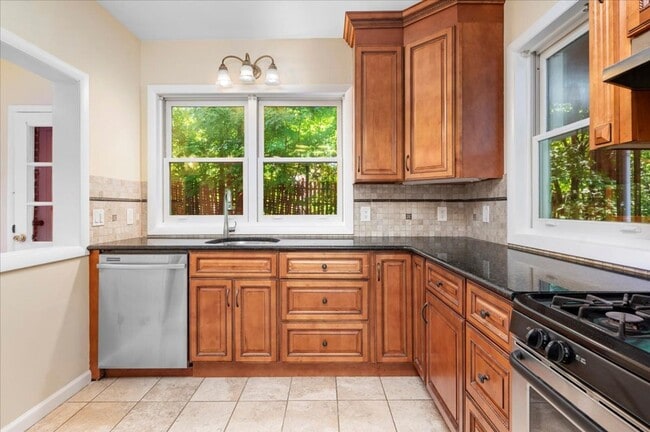 Building Photo - Elegant Multi-Level Brick Residence with Outdoor Oasis