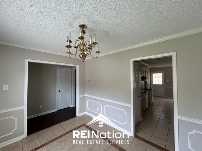 Spacious 4BR/2BA Near Southwind | High Ceilings, Brick Fireplace & 2-Car Garage