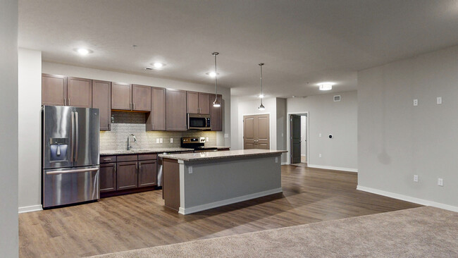 Our beautiful, modern kitchens have stainless steel appliances and plenty of counter space for all your cooking needs. - WH Flats Apartments