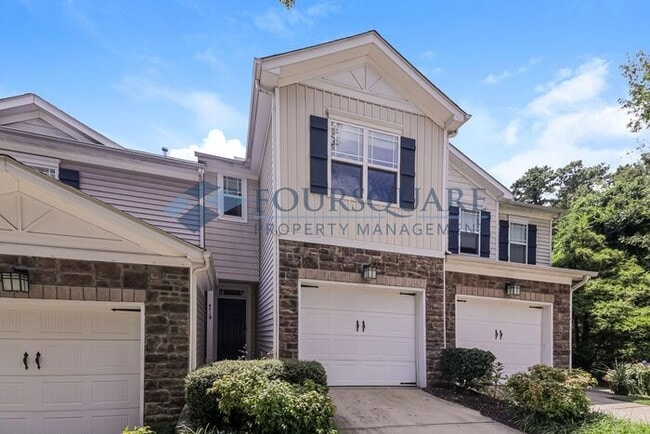 Building Photo - Townhome | Back Patio with Privacy Fence |...
