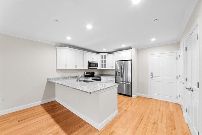 Photo - Top-Floor 2BR Condo with Balcony, Garage Parking & Amenities in Lexington Unit 244