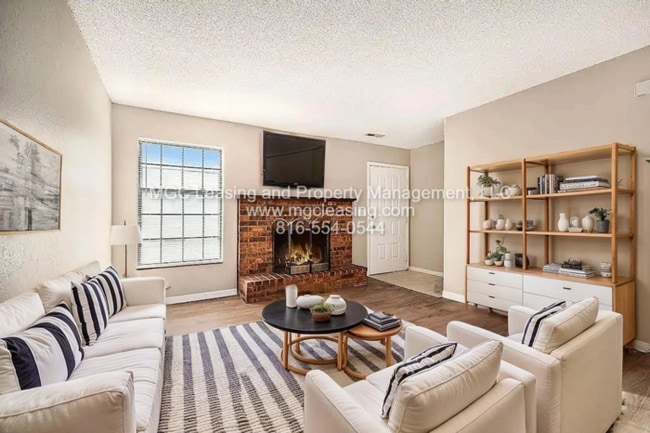 Building Photo - Millwood Townhomes - Blue Springs, MO - Reduced rent with a bonus of a brand-new 55" TV or a $250...