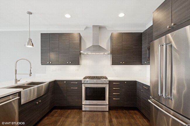 Spacious chefs kitchen with stainless steel appliances - 3047 N Oakley Ave Unit 401