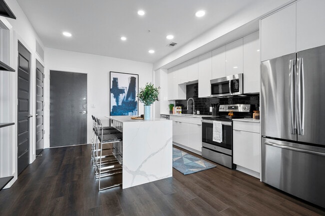 A1-Warhol I-Kitchen w/Waterfall Marble-top Island - Arya Peachtree Rental