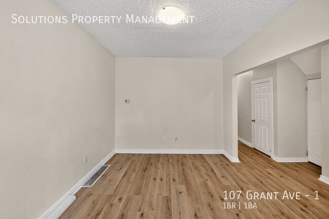 Photo - **Newly Updated Bright Main Floor, 1 Bed + Den** Unit 1