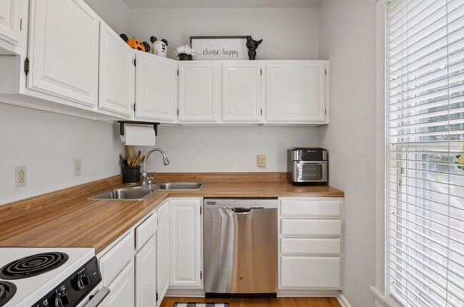 Full Kitchen, including stainless dishwasher, electric stove/oven, full fridge. Lots of storage - 2601 Portland Ave