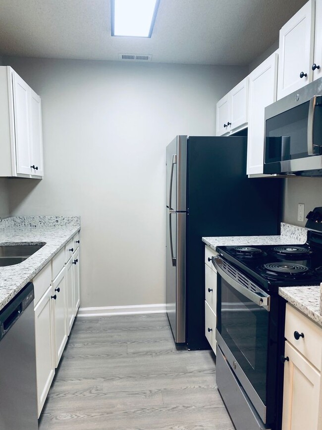 Photo - Spacious 2 Bedroom Townhomes in the Heart ... Unidad 1B