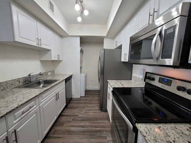 Kitchen with Granite countertops and Stainless Steel Appliances