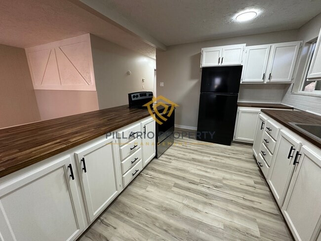 Photo - Spacious 4 Bedroom Home Featuring Open Layout & Hardwood Floors Available NOW!