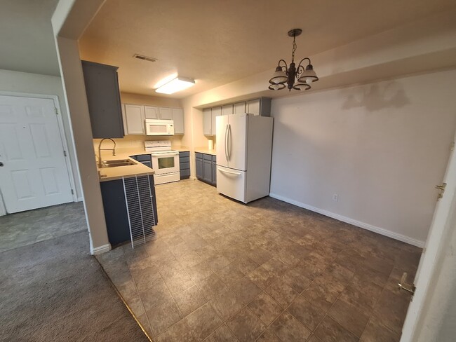 Kitchen area, new fridge and dishwasher. - 3314 E South Ridge Rd Condo Unit G2