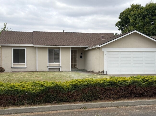 Building Photo - Recently updated home with new floors, paint & bathroom!