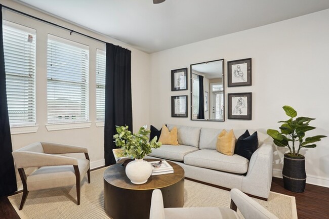 Living room with large windows and hardwood floor - Lakeview at the Gates of Prosper Apartments