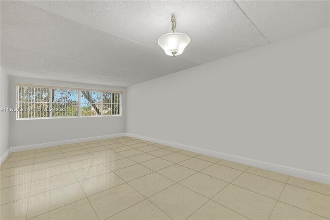 Building Photo - 6135 NW 186th St Unit 201