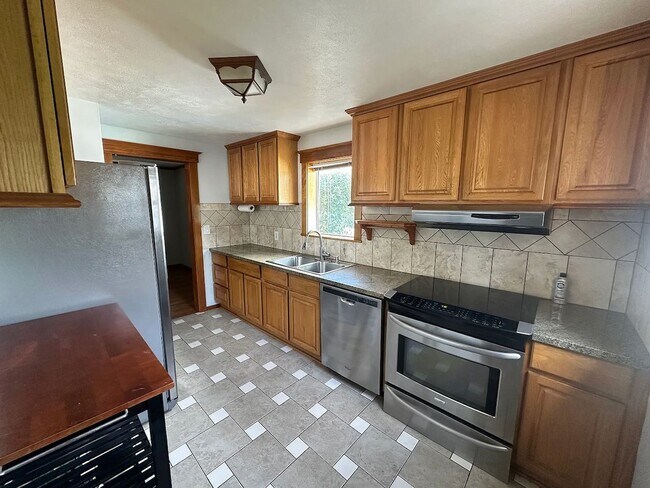 Photo - Ideally Located and Updated 4 Bed 2 Bath Fully-Fenced Home w/ Detached Garage/Shop!