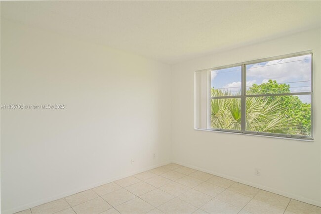 Photo - 9033 Wiles Rd Unit 303