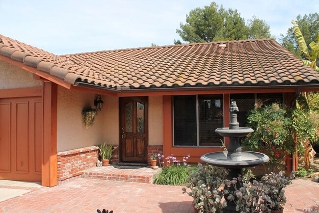 Building Photo - This incredible 4 bedroom single level home with private GATE entry