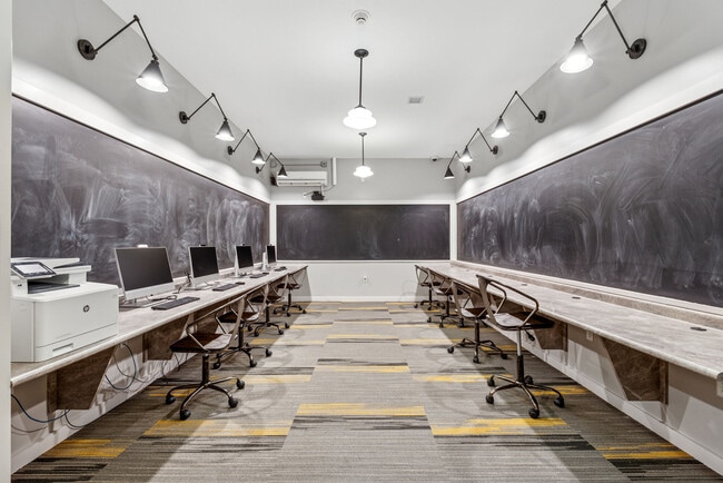 Community gathering space with modern seating, dining areas, and resident amenities