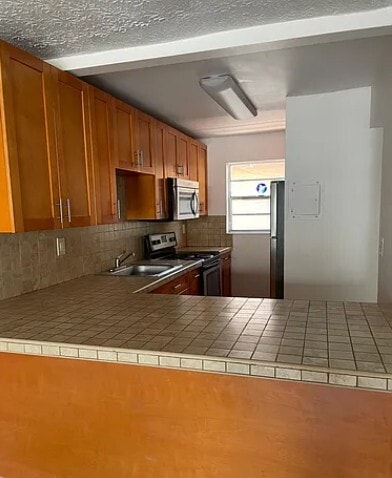 Building Photo - 6055 W 19th Ave Unit 218