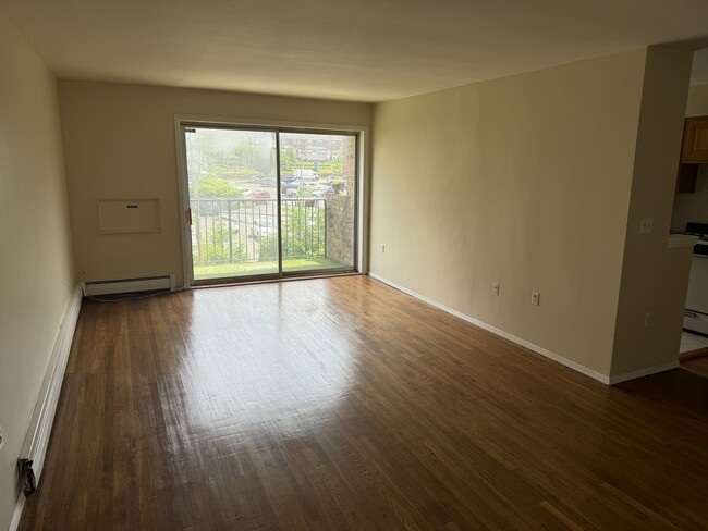 Spacious Living Room with private balcony - 765 Vose Ave Condo Unit D