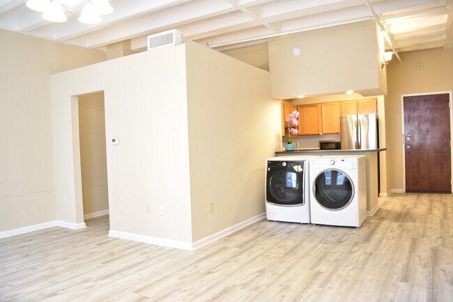 Left door to the closet and bathroom. Right door is the main entrance. Kitchen, and washer dryer