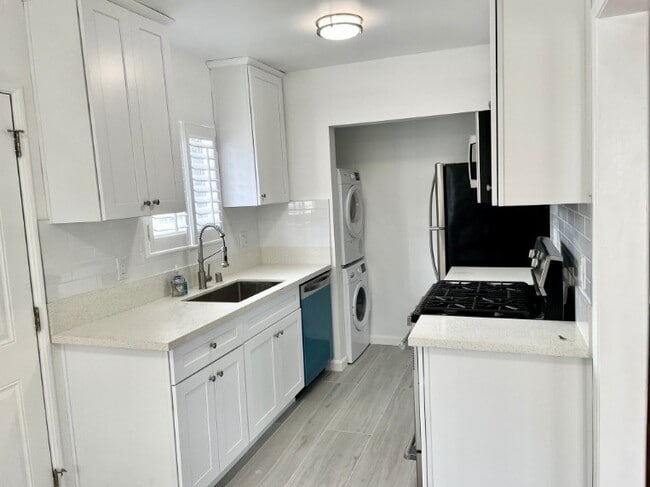 kitchen with stainless steel appliances &quartz countertops - 3408 Pearl St
