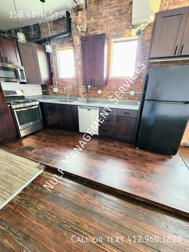 Building Photo - 158 48th St Unit 1
